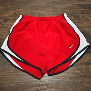 Women’s red Nike dri-fit running shorts